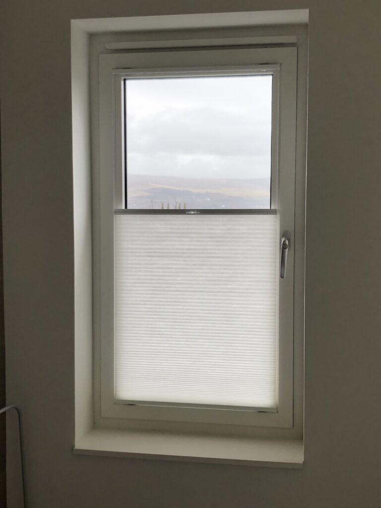 Tensioned, bottom-up Luxaflex Duette blind on a tilt & turn window by The Scottish Shutter Company