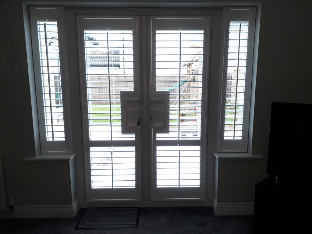 Window Shutters with a French Door Cutout for the Door Handle