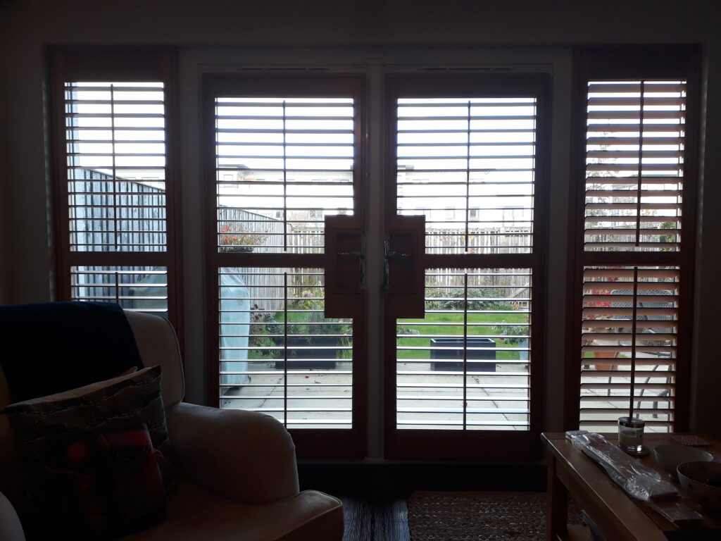 Window Shutters with a French Door Cutout for the Door Handle