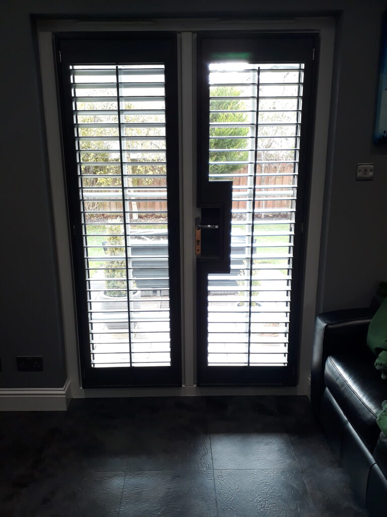 Window Shutters with a French Door Cutout for the Door Handle