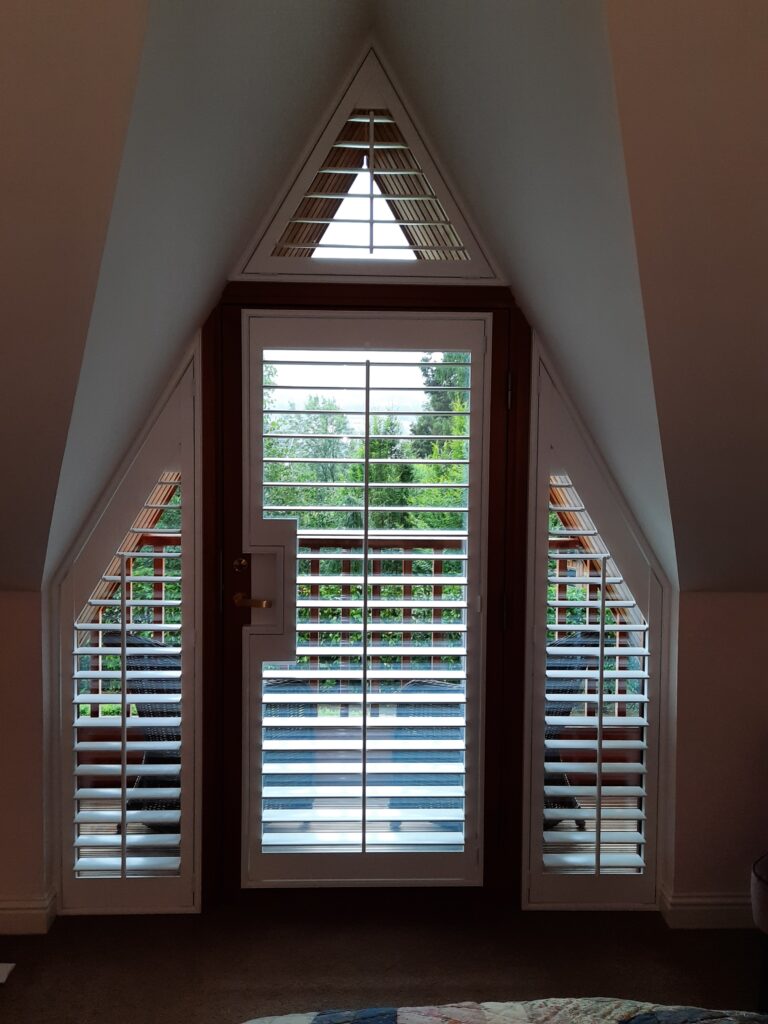 Window Shutters with a French Door Cutout for the Door Handle