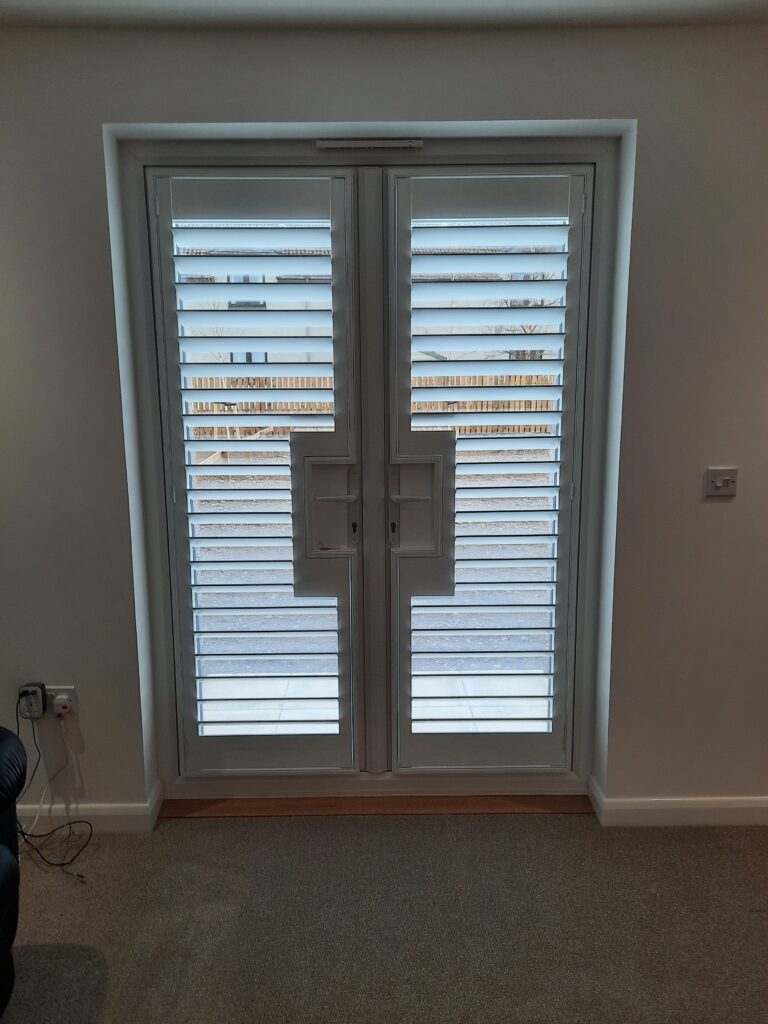 Window Shutters with a French Door Cutout for the Door Handle