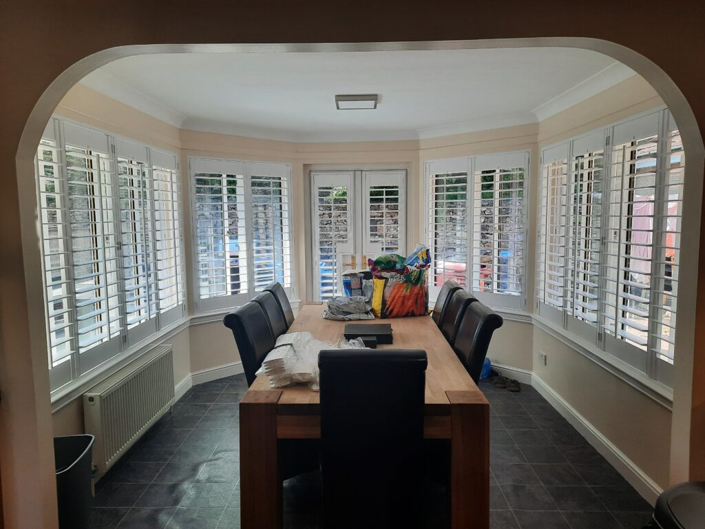 Window Shutters with a French Door Cutout for the Door Handle