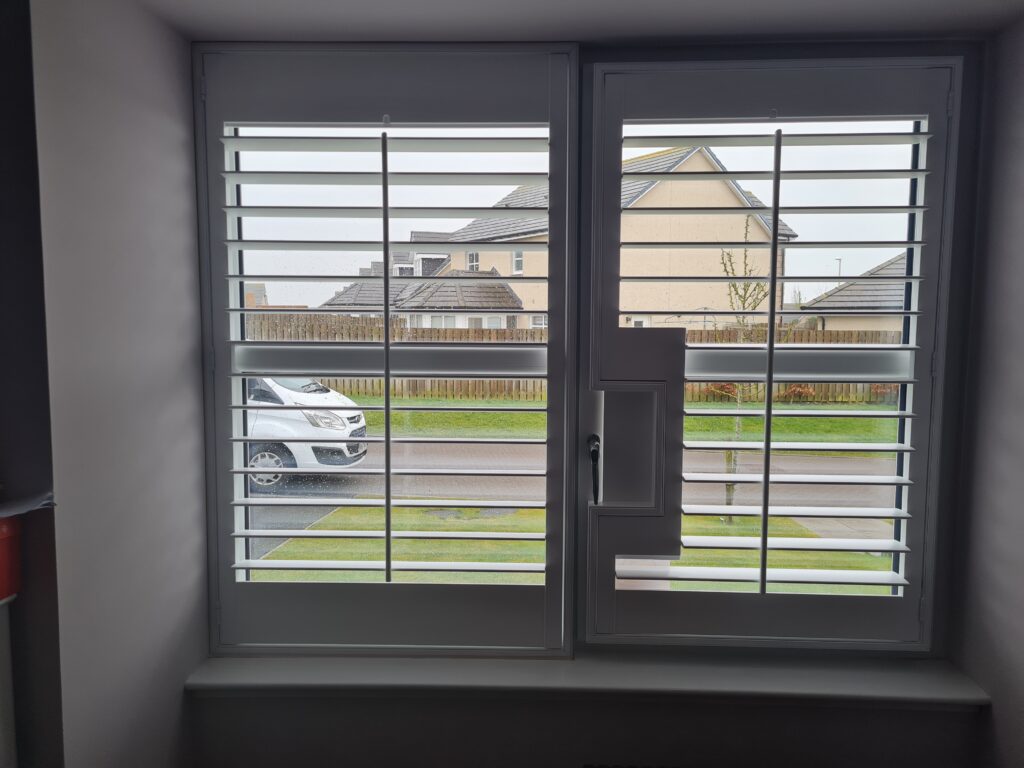 Window Shutters with a French Door Cutout for the Door Handle
