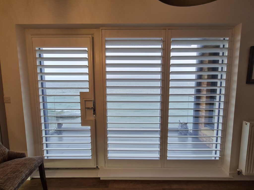 Window Shutters with a French Door Cutout for the Door Handle