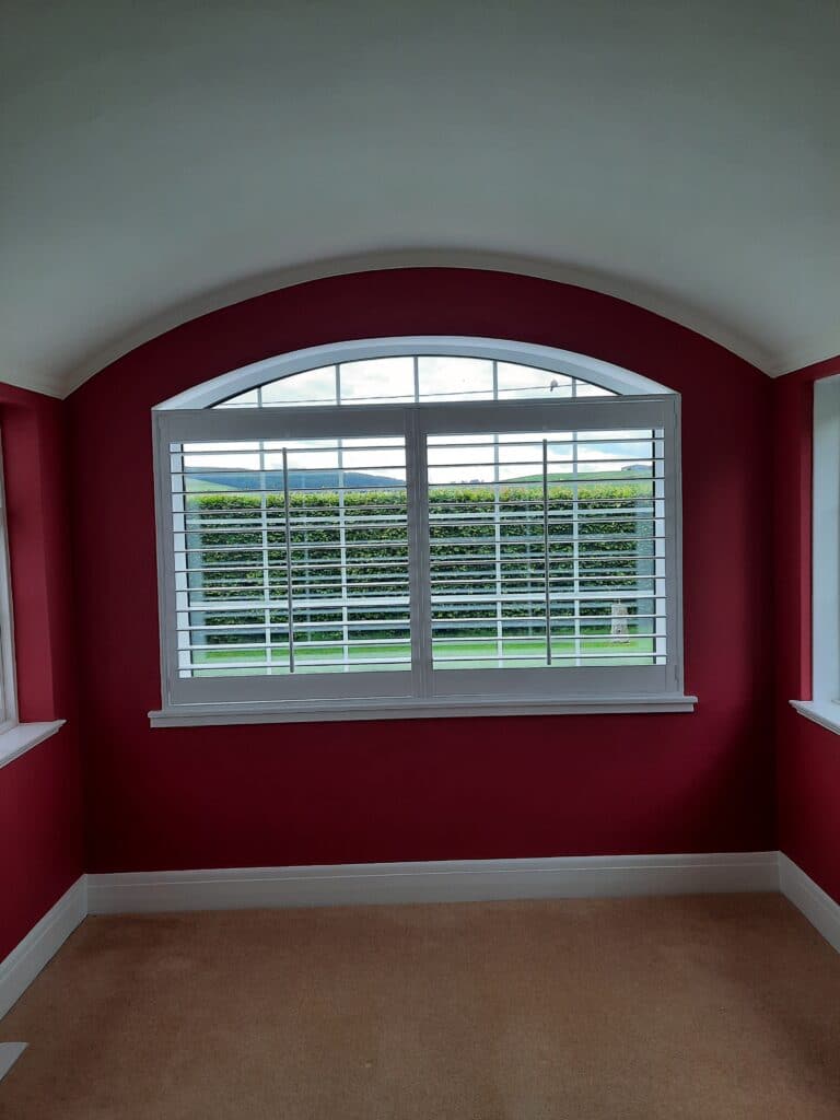 Rectangular Window Shutters in an Arched Window