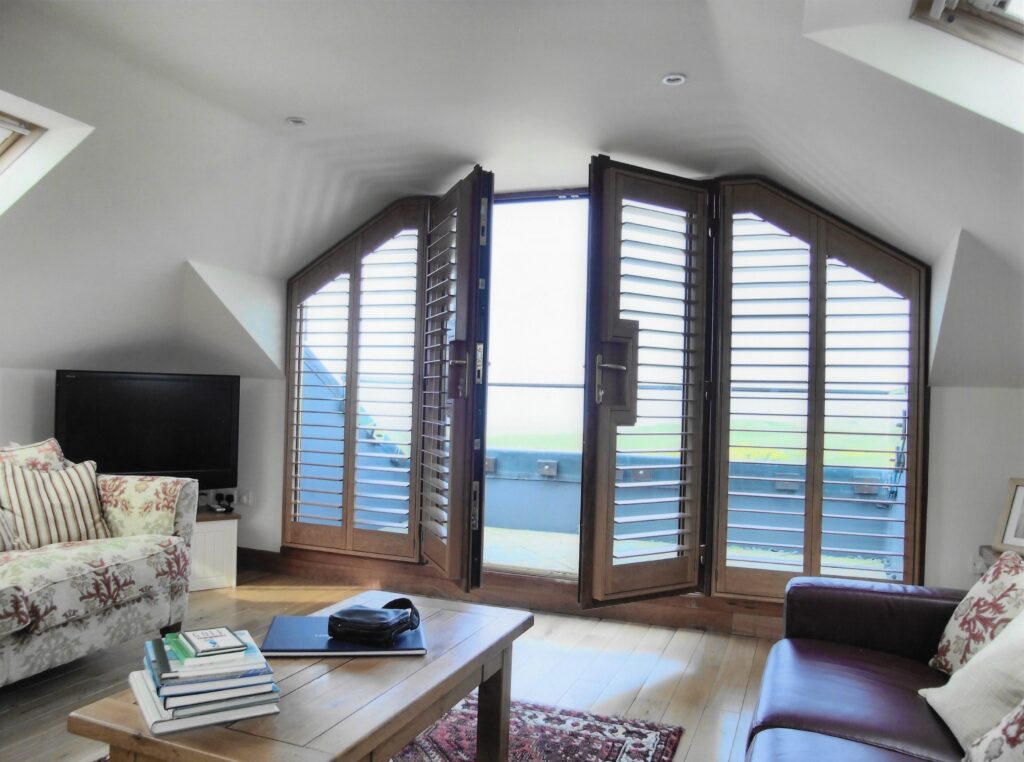 Shaped Shutters with French Door Cut-out on the Patio Doors by The Scottish Shutter Company