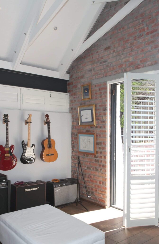 Hinged, Bi-folding Internal Security Shutters  in a Music Room