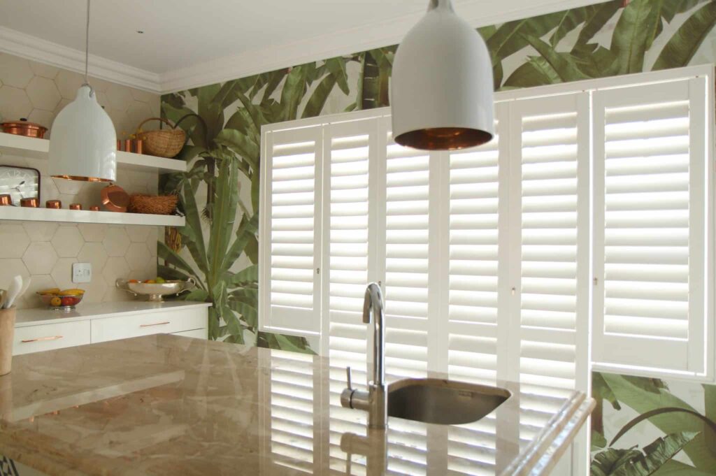 Satin White Six Panel, Tracked Security Shutters  in a Kitchen