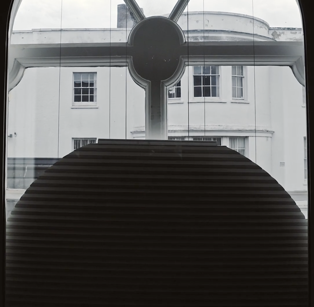 Arched, motorised, stack-at-the-bottom, Duette blind 2