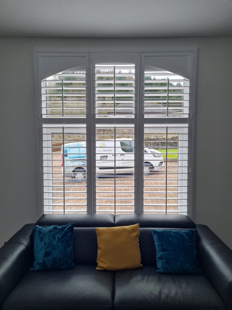 Arched Window Shutters Inside a Rectangular Frame