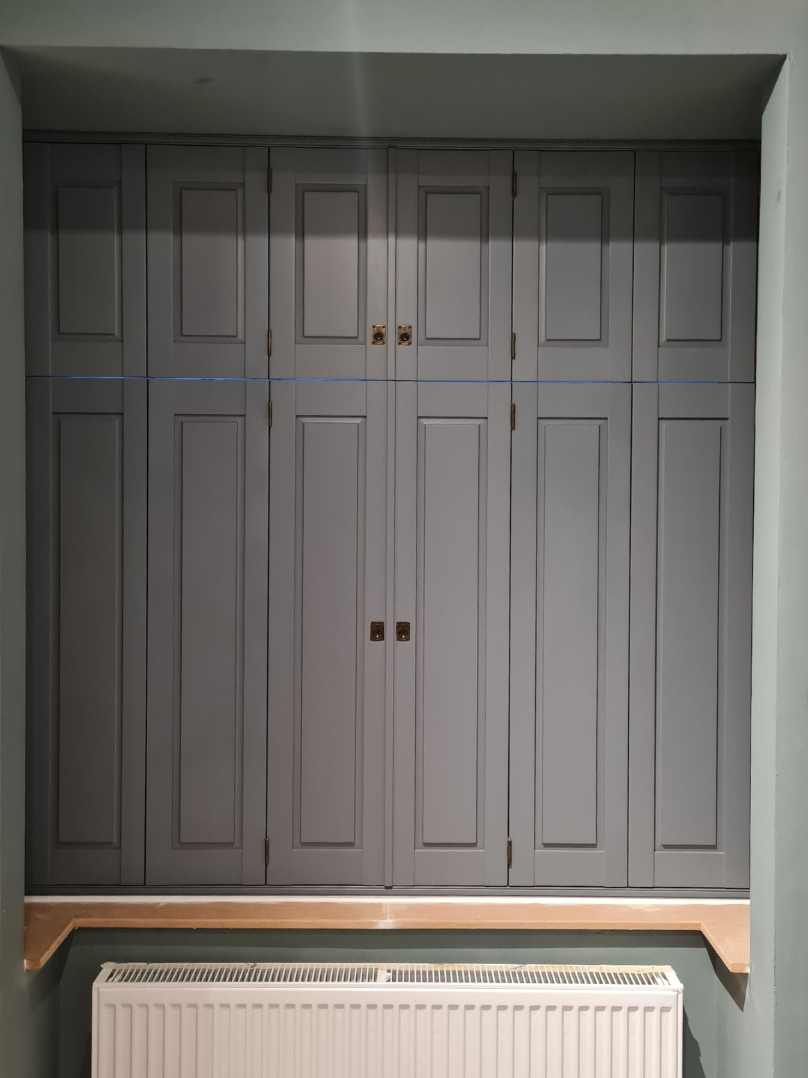Painted solid Fiji shutters by S:CRAFT, showing the continuous panel construction that provides superior noise reduction