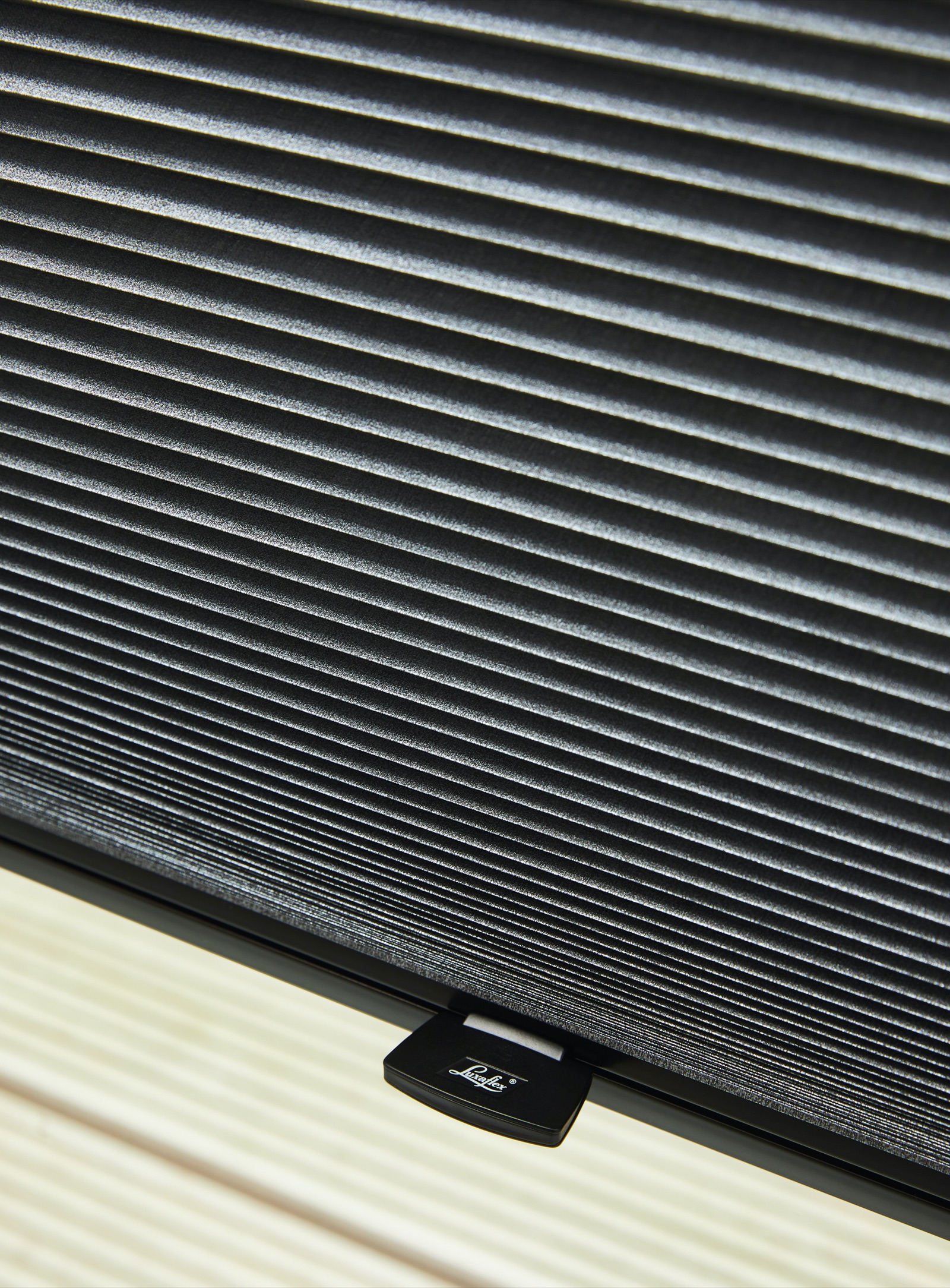 Close-up of a Luxaflex Duette cellular blind showing the honeycomb fabric structure